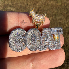 iced out goat pendant shown outside in sunlight