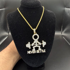 Never Settle Iced Out Pendant 14k Gold Plated